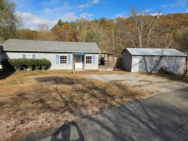 view of front facade featuring an outbuilding and a garage