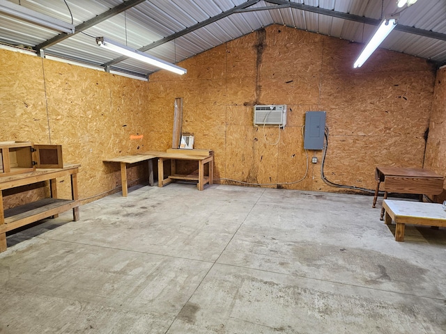 garage with electric panel and a wall mounted air conditioner