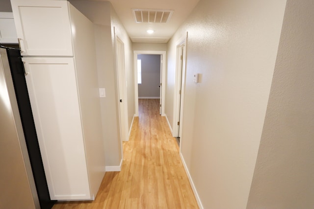 hallway featuring light hardwood / wood-style flooring