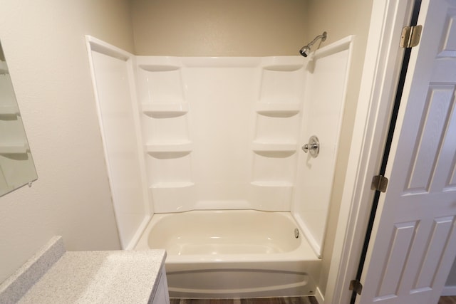 bathroom featuring vanity and washtub / shower combination