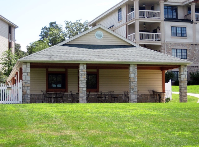 250 Lakewood Dr Unit 6303, Hollister, MO 65672 - view of front of property featuring a shingled roof, a front lawn, and stone siding