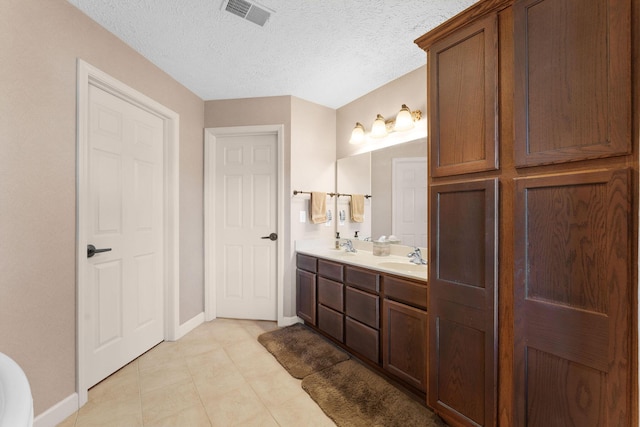 250 Lakewood Dr Unit 6303, Hollister, MO 65672 - bathroom featuring double vanity, baseboards, and tile patterned flooring