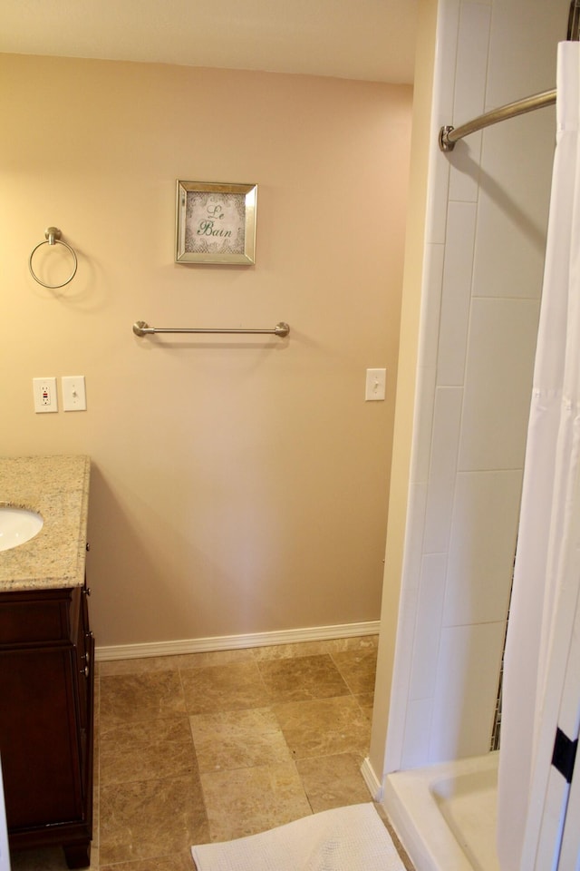 bathroom with vanity and curtained shower