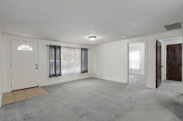 entryway with light carpet