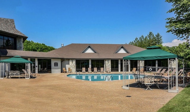 view of pool featuring a patio and a gazebo