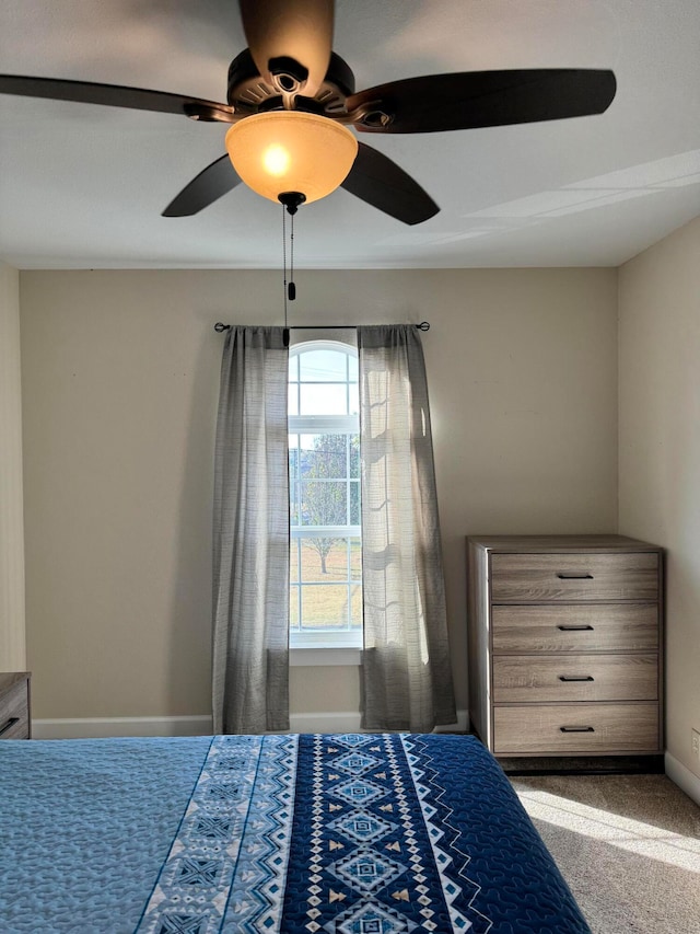 unfurnished bedroom with carpet flooring and ceiling fan