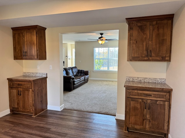 kitchen featuring dark wood-type flooring and ceiling fan