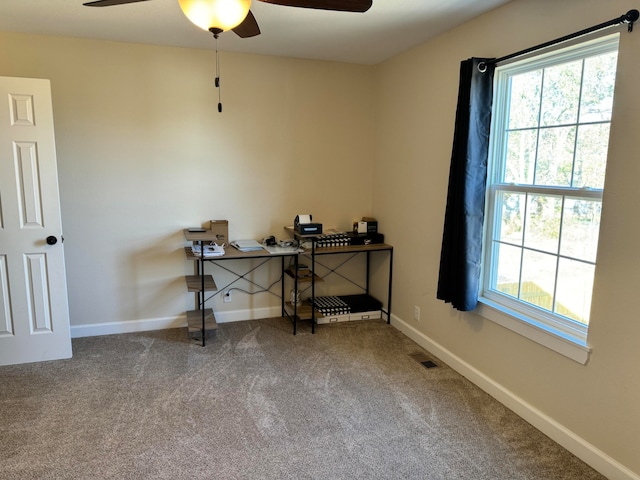 office space with carpet, a healthy amount of sunlight, and ceiling fan