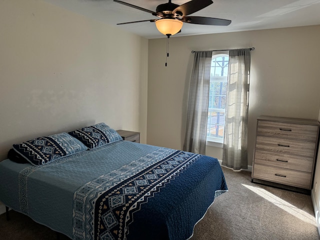 bedroom with ceiling fan and carpet floors