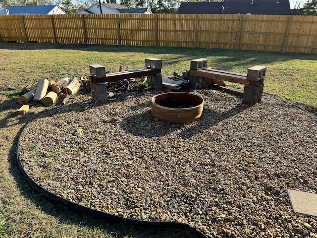 view of yard with a fire pit