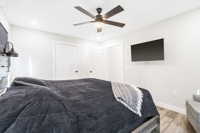 bedroom featuring hardwood / wood-style flooring and ceiling fan