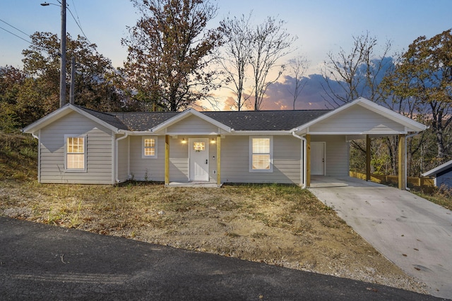 ranch-style house with a carport