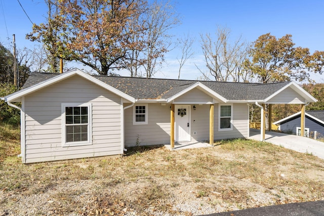 ranch-style house with a carport