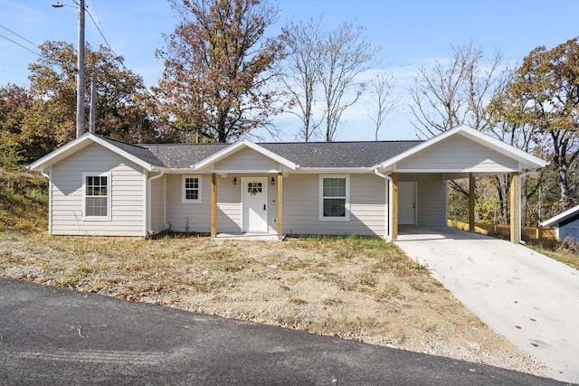 ranch-style home with a carport