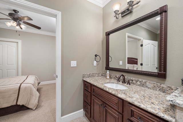 bathroom featuring vanity, crown molding, and ceiling fan