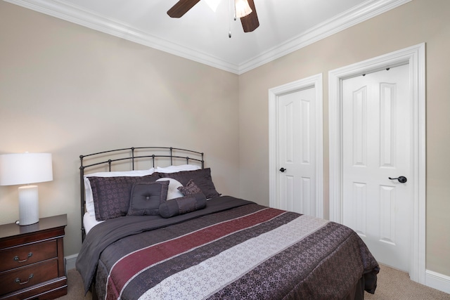 carpeted bedroom featuring crown molding and ceiling fan