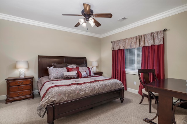 carpeted bedroom with ornamental molding and ceiling fan