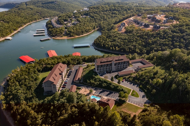 birds eye view of property with a water view