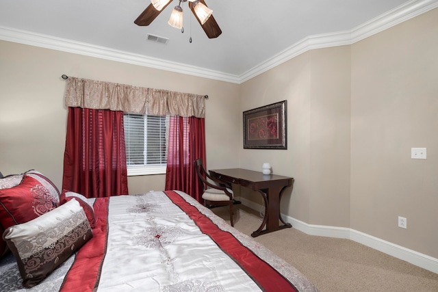 carpeted bedroom featuring ceiling fan and crown molding