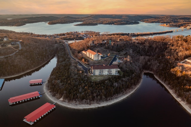 aerial view at dusk with a water view