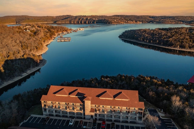 aerial view at dusk with a water view