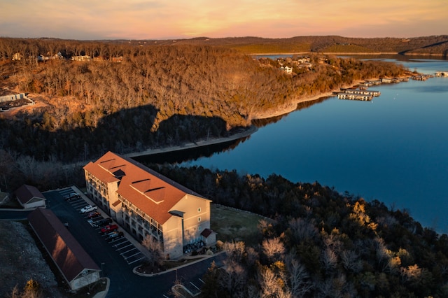 aerial view at dusk with a water view