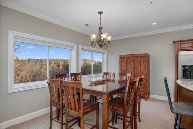 carpeted dining area with crown molding and an inviting chandelier