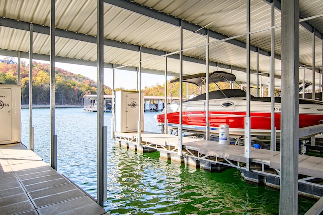 view of dock with a water and mountain view