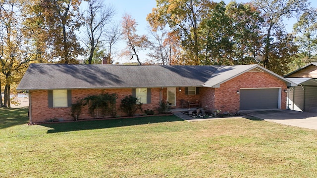 single story home featuring a front lawn and a garage