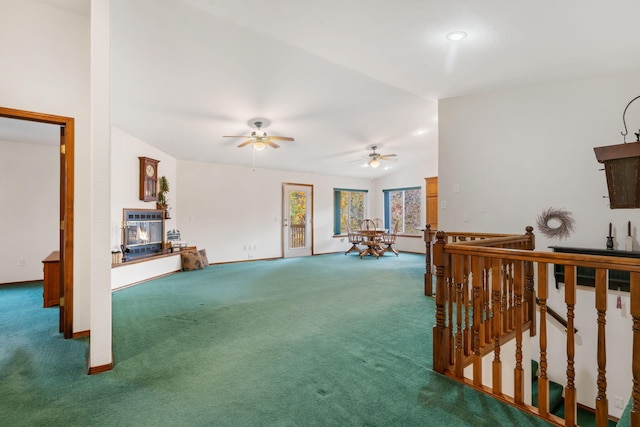 carpeted living room with vaulted ceiling