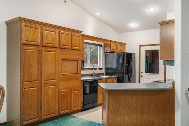 kitchen with kitchen peninsula, sink, black appliances, vaulted ceiling, and light colored carpet