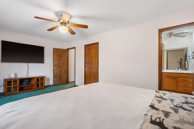 carpeted bedroom featuring ceiling fan and ensuite bath