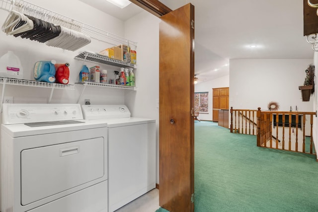 clothes washing area with washer and dryer and light colored carpet