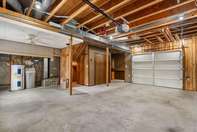 garage with ceiling fan, a garage door opener, and water heater