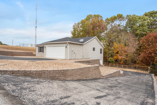 view of side of property featuring a garage