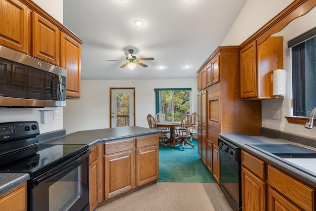 kitchen featuring light carpet, black appliances, sink, and ceiling fan