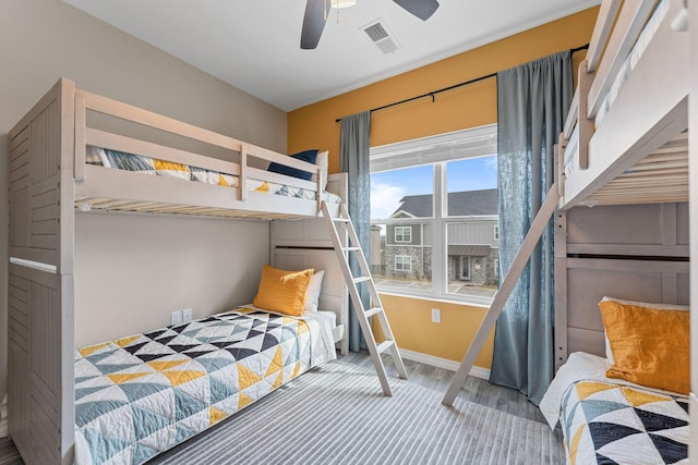 bedroom featuring wood-type flooring and ceiling fan