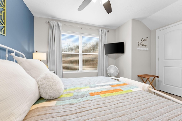 bedroom featuring lofted ceiling and ceiling fan