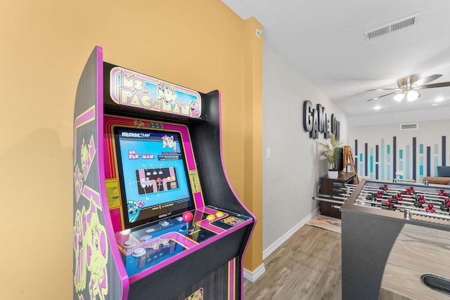 playroom with ceiling fan and hardwood / wood-style floors