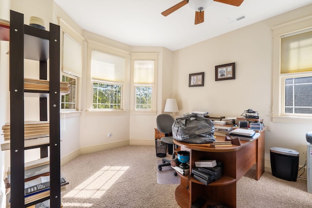 home office featuring light colored carpet and ceiling fan