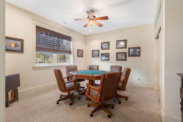 interior space featuring light carpet and ceiling fan