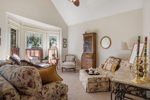 carpeted living room featuring high vaulted ceiling