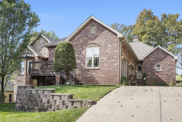 view of front of house with a front yard and a deck