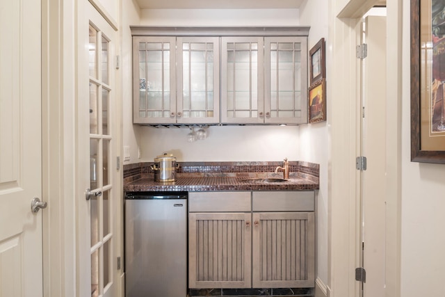 bar featuring dishwasher and sink