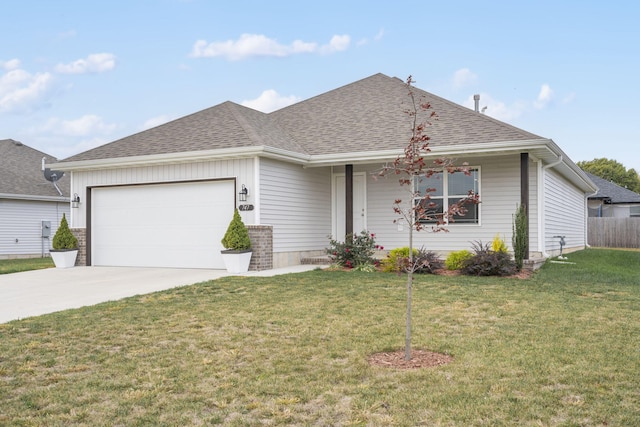 single story home with a garage and a front lawn