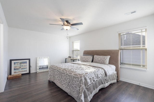 bedroom with dark wood-type flooring and ceiling fan