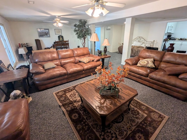 carpeted living room with ceiling fan