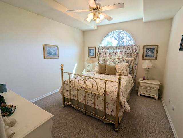 bedroom featuring dark colored carpet and ceiling fan