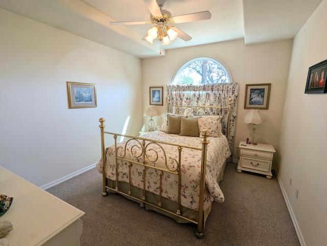 bedroom featuring dark carpet and ceiling fan