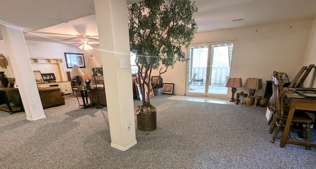 carpeted living room featuring ceiling fan